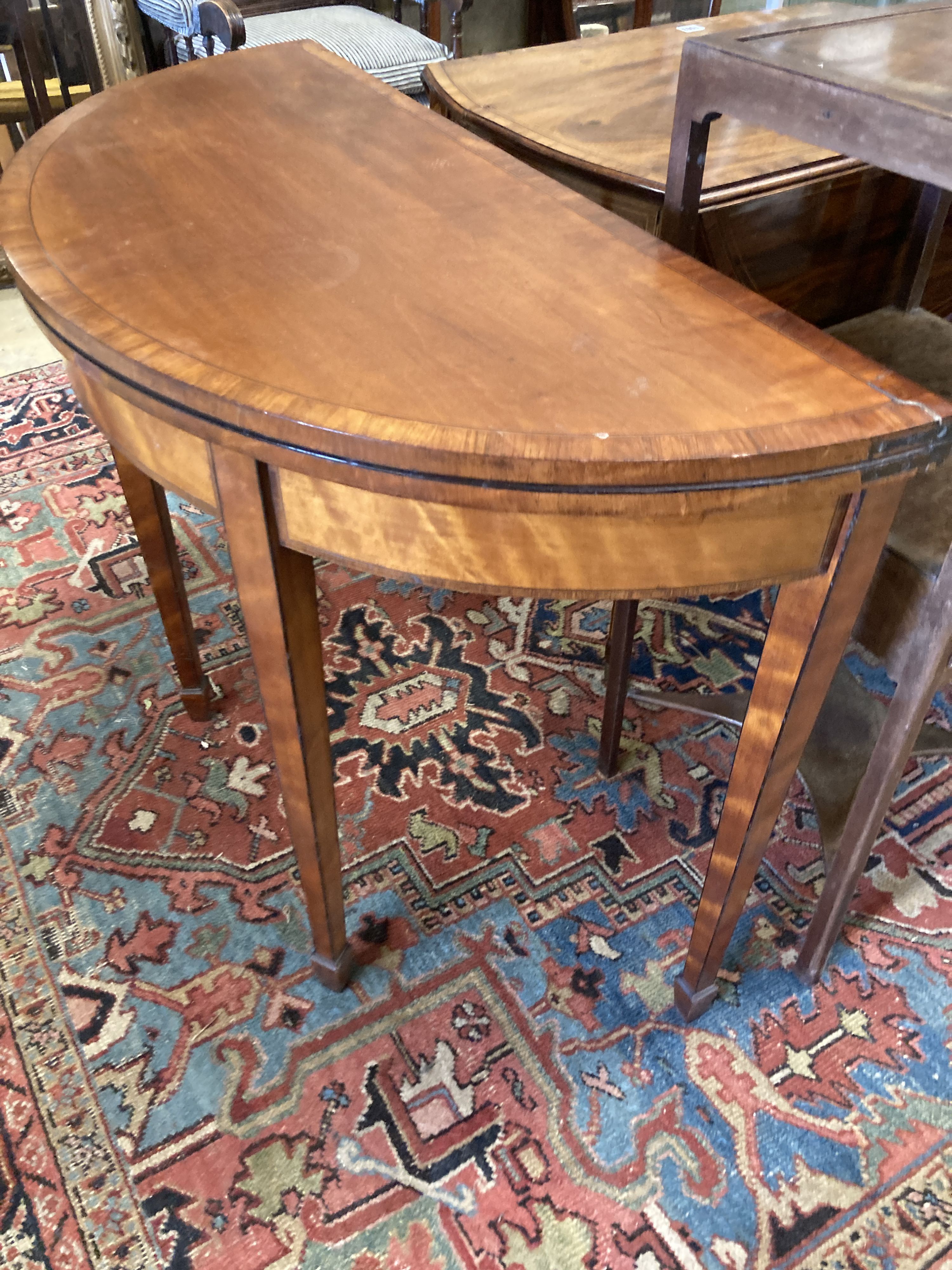 A George III satinwood demi lune folding card table, width 91cm, depth 42cm, height 71cm